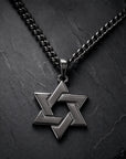 All Black Star of David Necklace, editorial close-up on dark slate