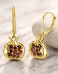 Pomegranate Earrings, editorial close-up on marble