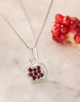 Pomegranate Necklace, editorial close-up on marble