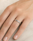 This Too Shall Pass Band Ring on her finger, Hebrew engraving visible